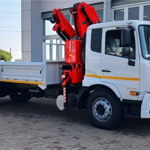 Mobile crane lifting construction materials on a building site in Nairobi, Kenya providing professional crane hire and heavy lifting services